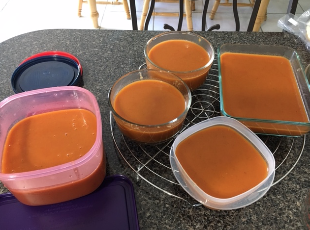 Homemade tomato soup in containers