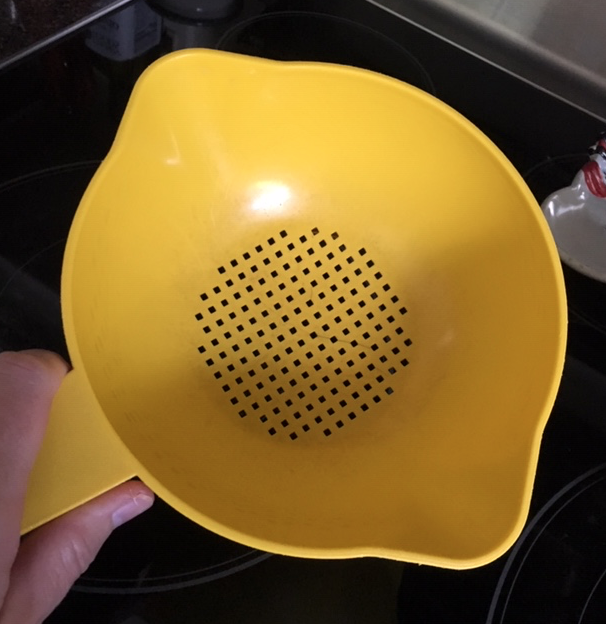 Yellow plastic colander 