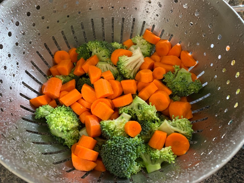 carrots and broccoli chopped in strainer