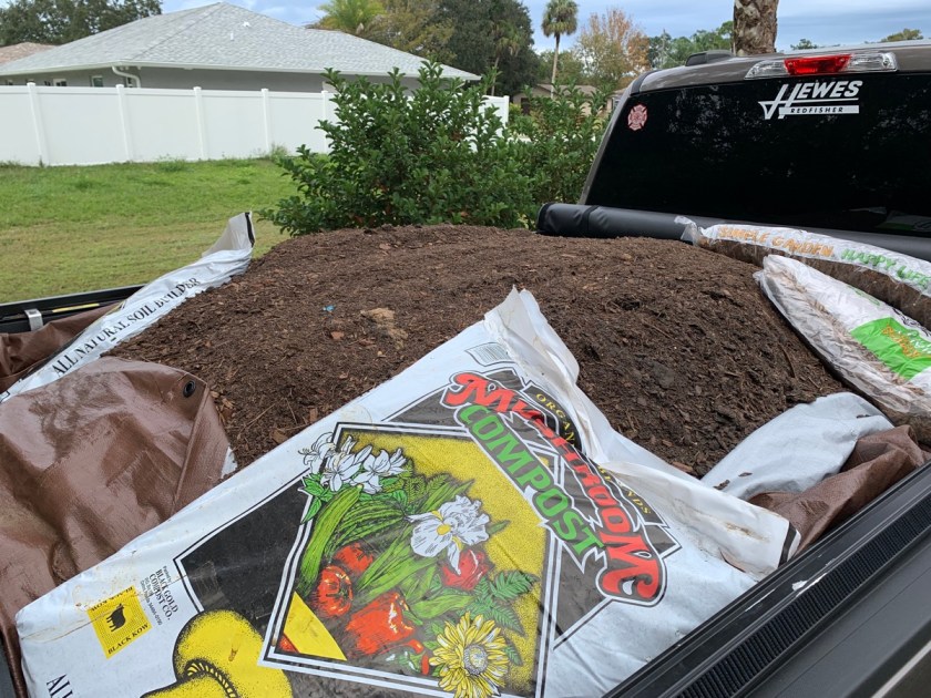 dirt and compost in truck bed