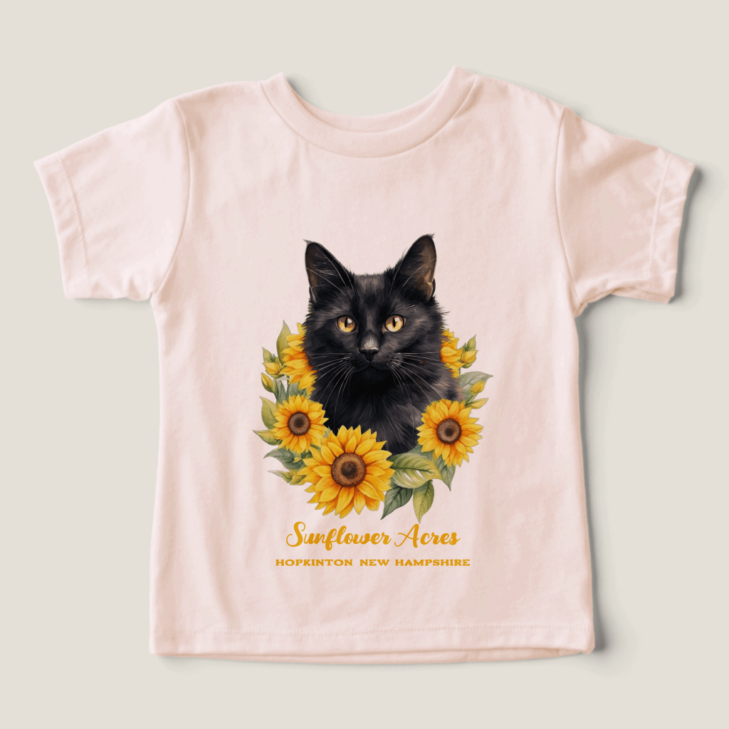 pink tee with black cat and yellow sunflowers wreath with two lines of custom text