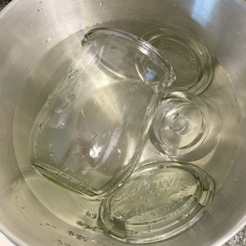 Rinsing the Weck glassware in pure water.