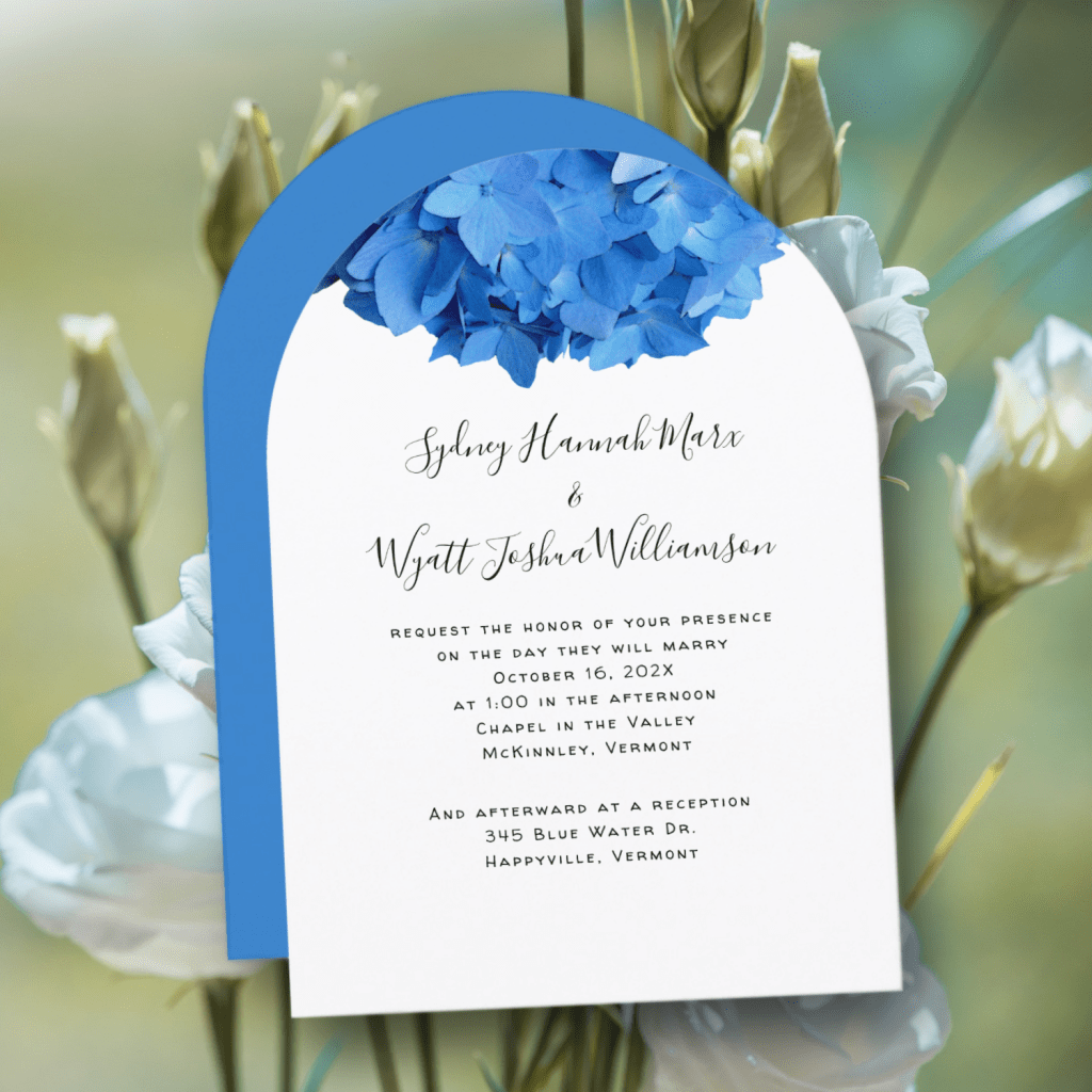 Arch shape wedding invitations with blue flowers at top.